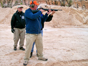 The Instructor candidates switch roles in the coach/pupil method to teach rifle shooting.