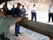 Pistol-- Instructor candidates practice teaching the use of a benchrest.
